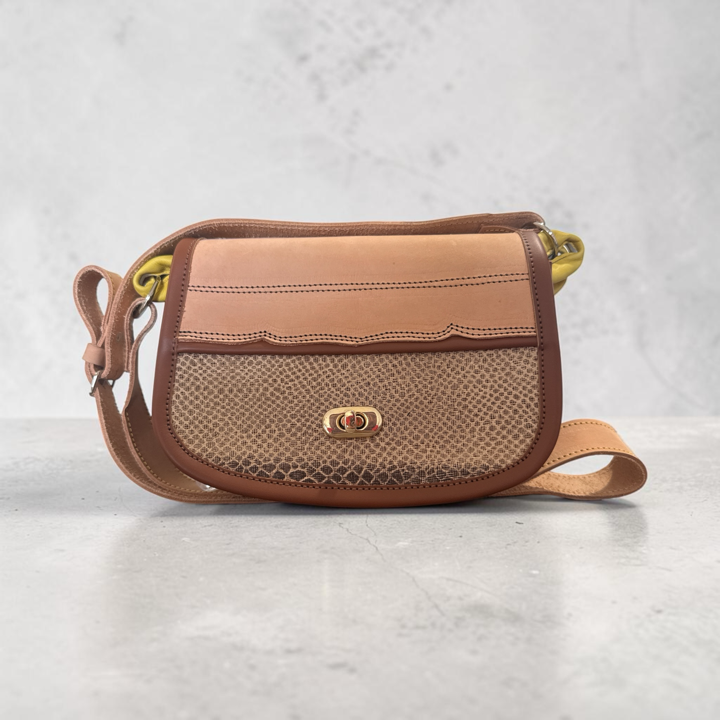 Compact two-tone leather Carriel in earth colors, front view
