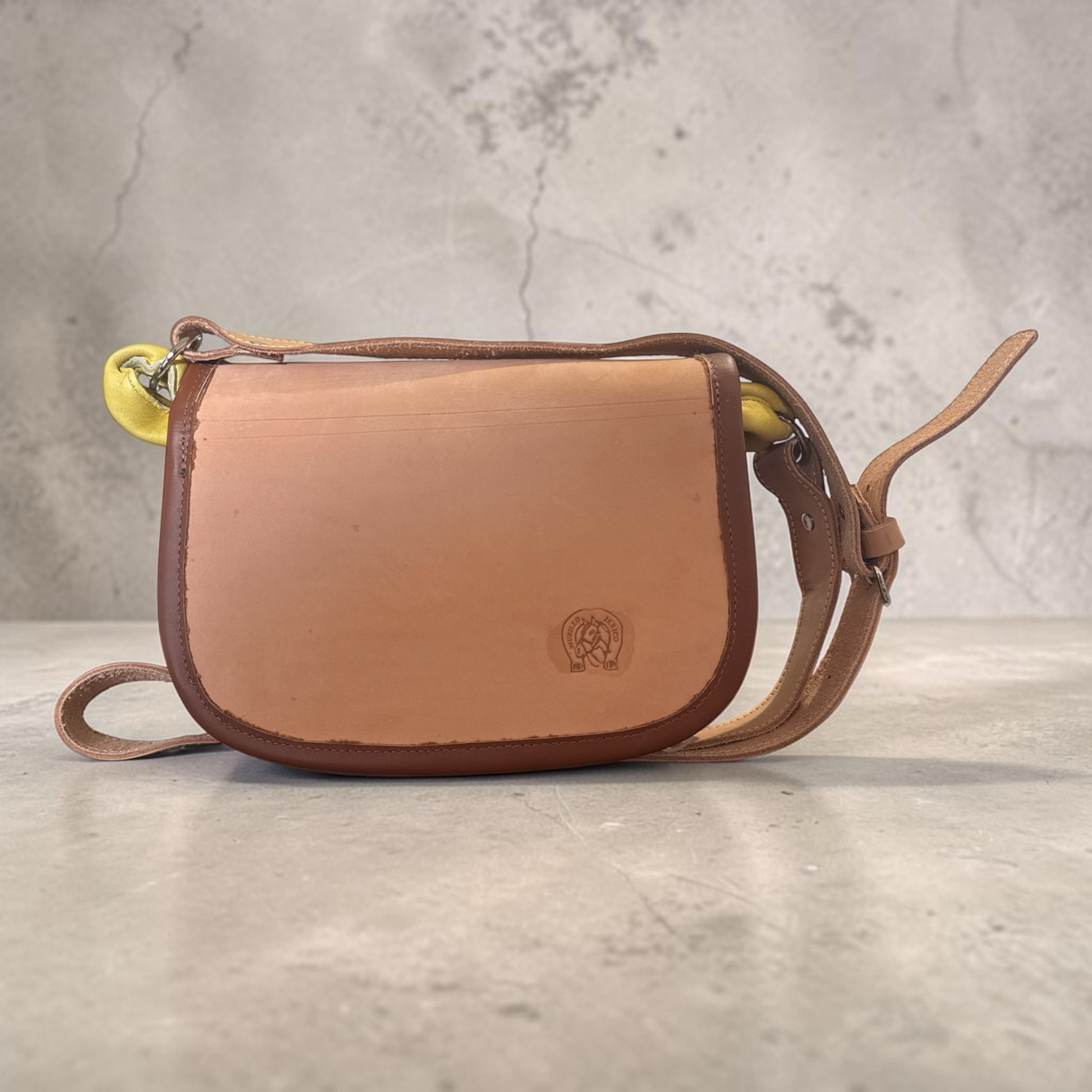 Open compact Colombian leather bag showing 6 pockets